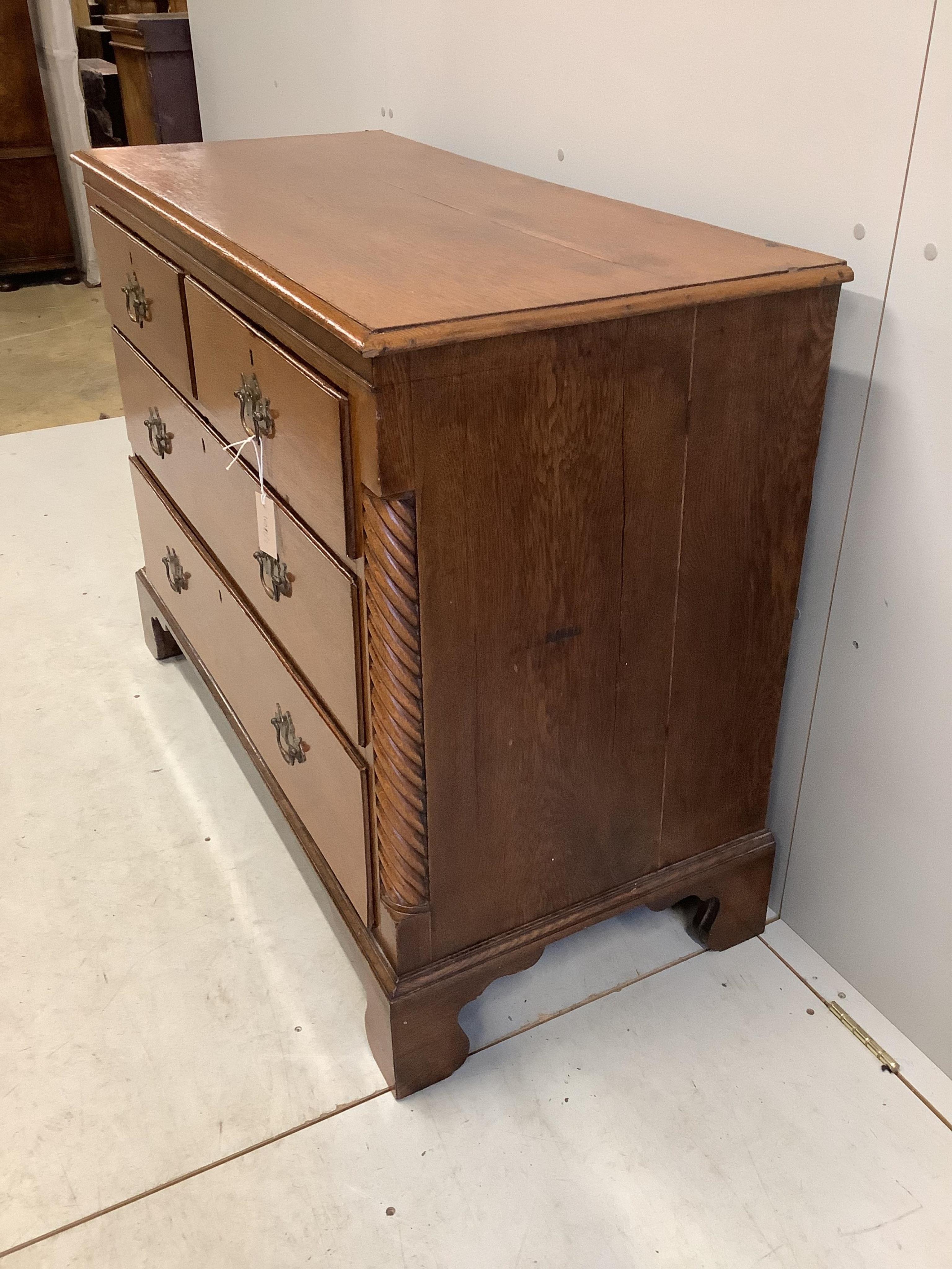 A George III oak four drawer chest, width 114cm, depth 51cm, height 88cm. Condition - fair